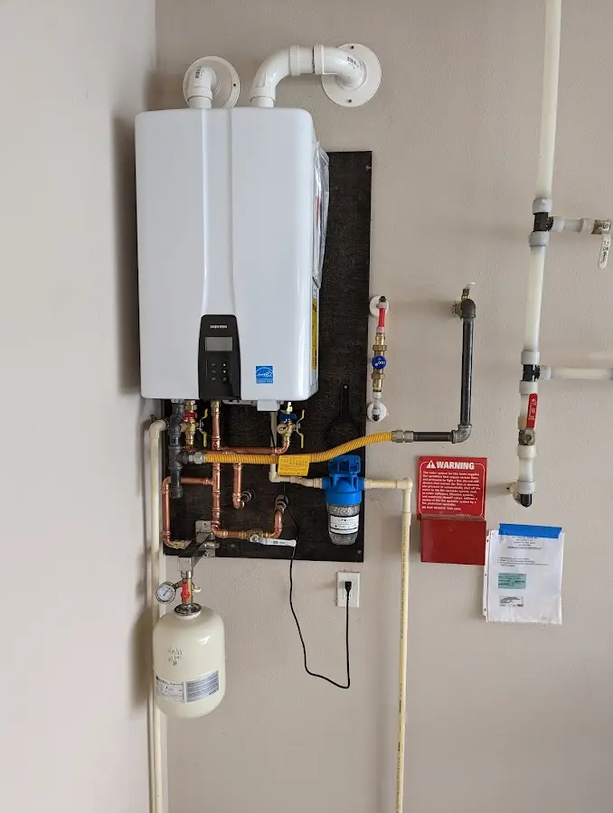 Professional plumber installing copper piping in a Sebring home